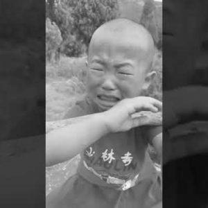 Shaolin boy very hard learning kung fu.  Chinese language kung fu